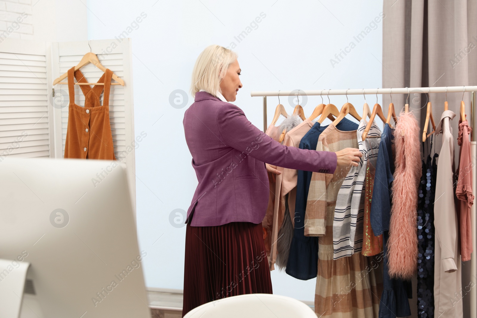 Photo of Female business owner working in her boutique