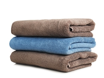 Folded soft terry towels on white background