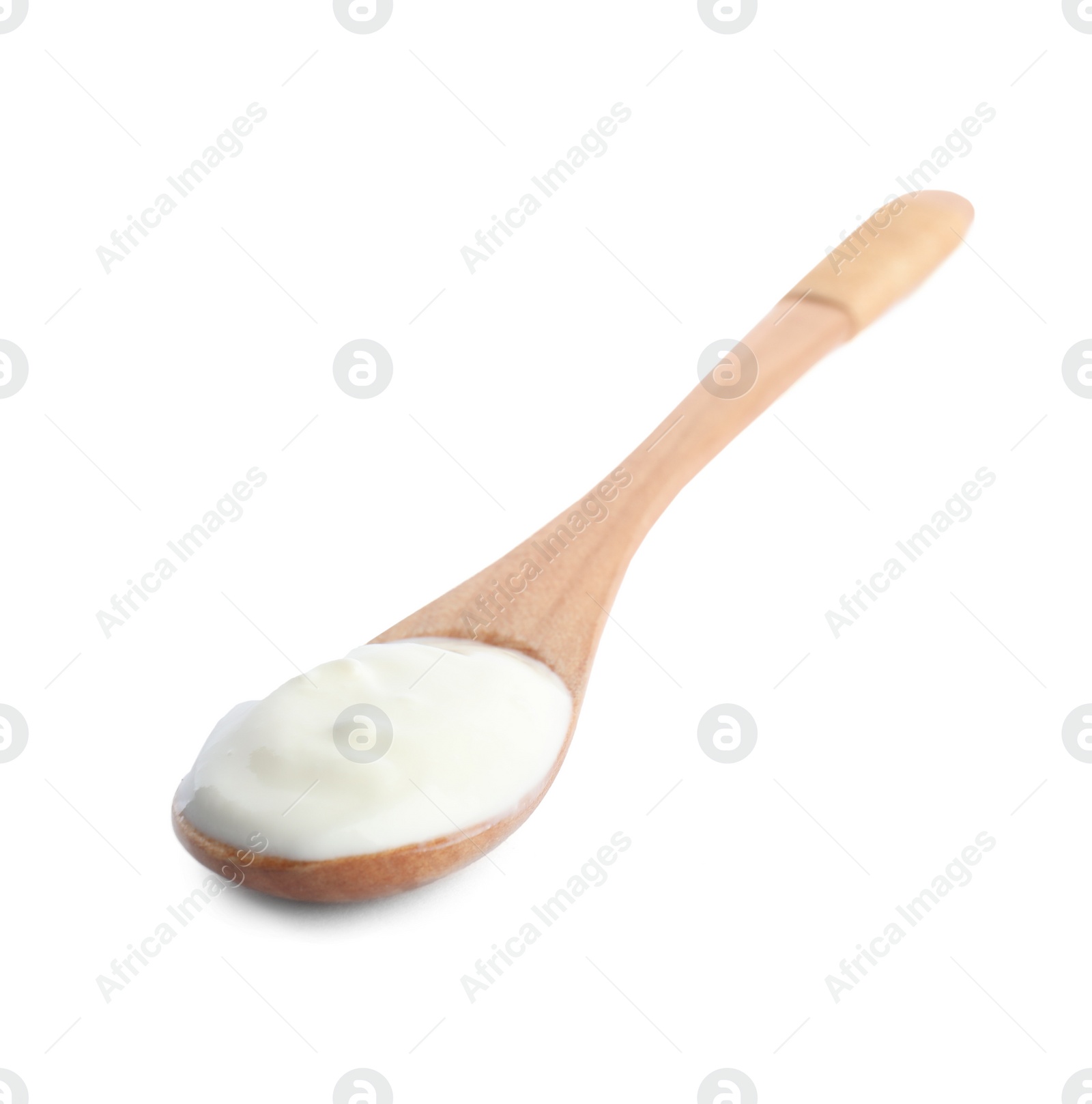 Photo of Wooden spoon with tasty organic yogurt isolated on white