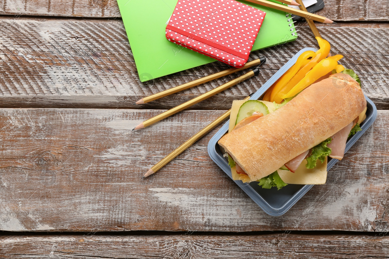 Photo of Composition with lunch box on wooden background