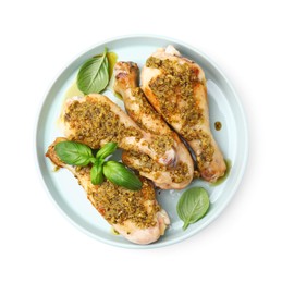 Photo of Delicious fried chicken drumsticks with pesto sauce and basil isolated on white, top view