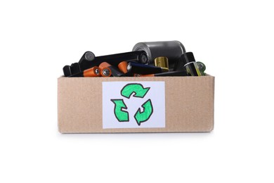 Used electric batteries in cardboard box with recycling symbol on white background