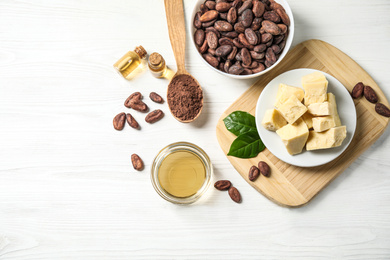 Photo of Flat lay composition with organic cocoa butter on white wooden table