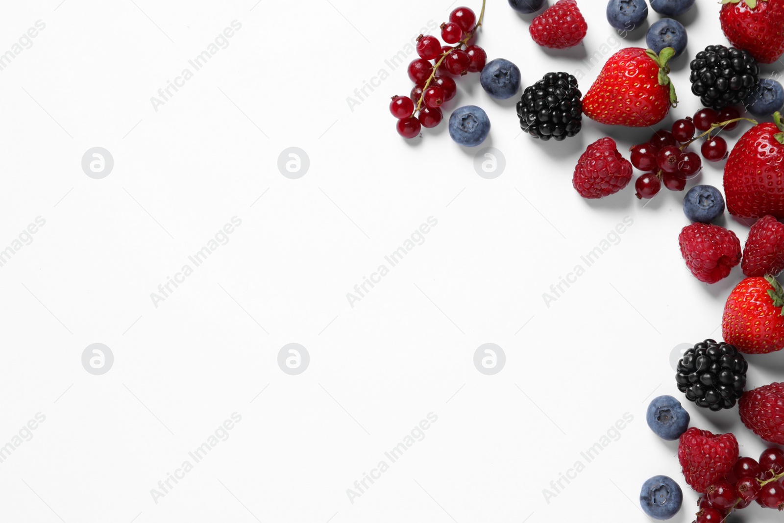 Photo of Many different fresh berries on white background, flat lay. Space for text