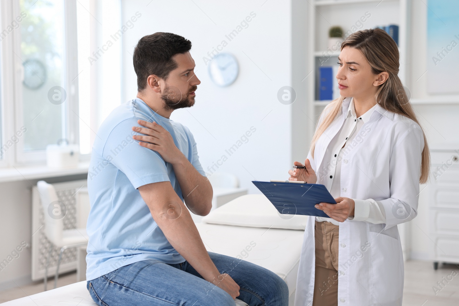 Photo of Professional doctor working with patient in hospital