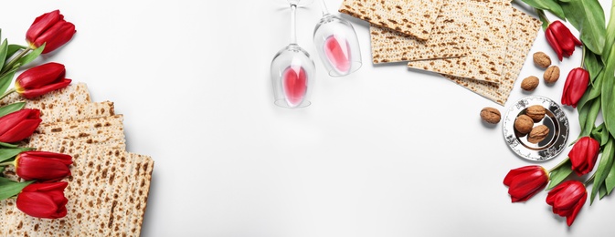 Image of Flat lay composition with matzos on white background, space for text. Passover (Pesach) celebration