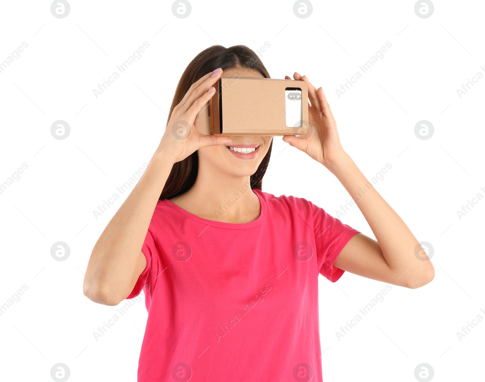 Photo of Young woman using cardboard virtual reality headset, isolated on white