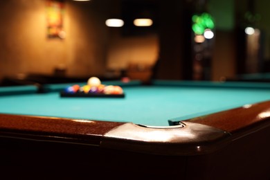 Photo of Stylish billiard table indoors, selective focus. Space for text