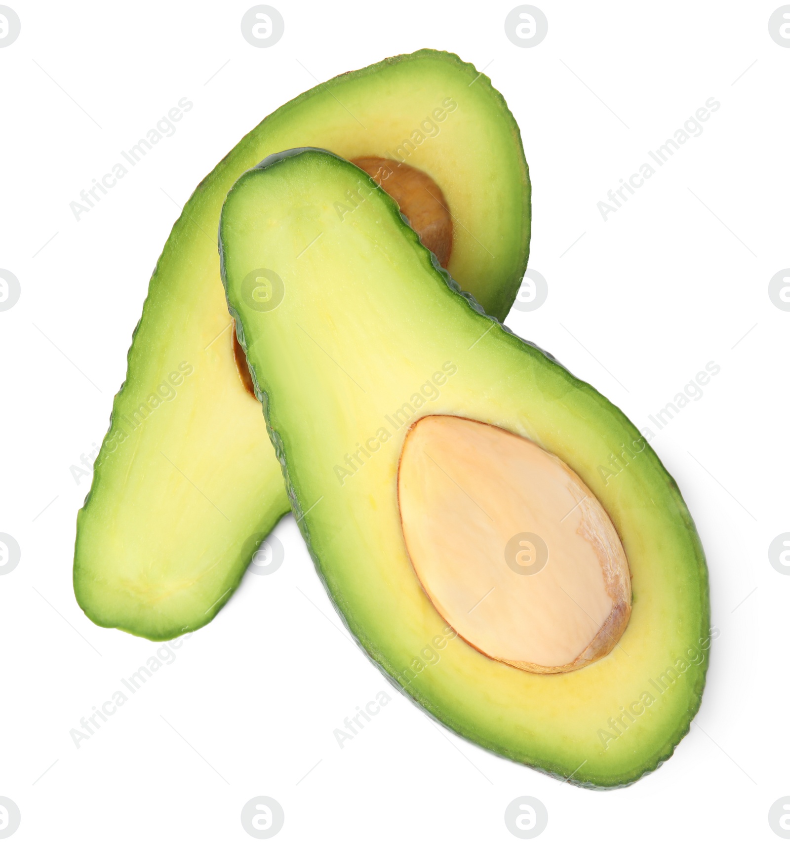 Photo of Cut tasty ripe avocados on white background, top view. Tropical fruit