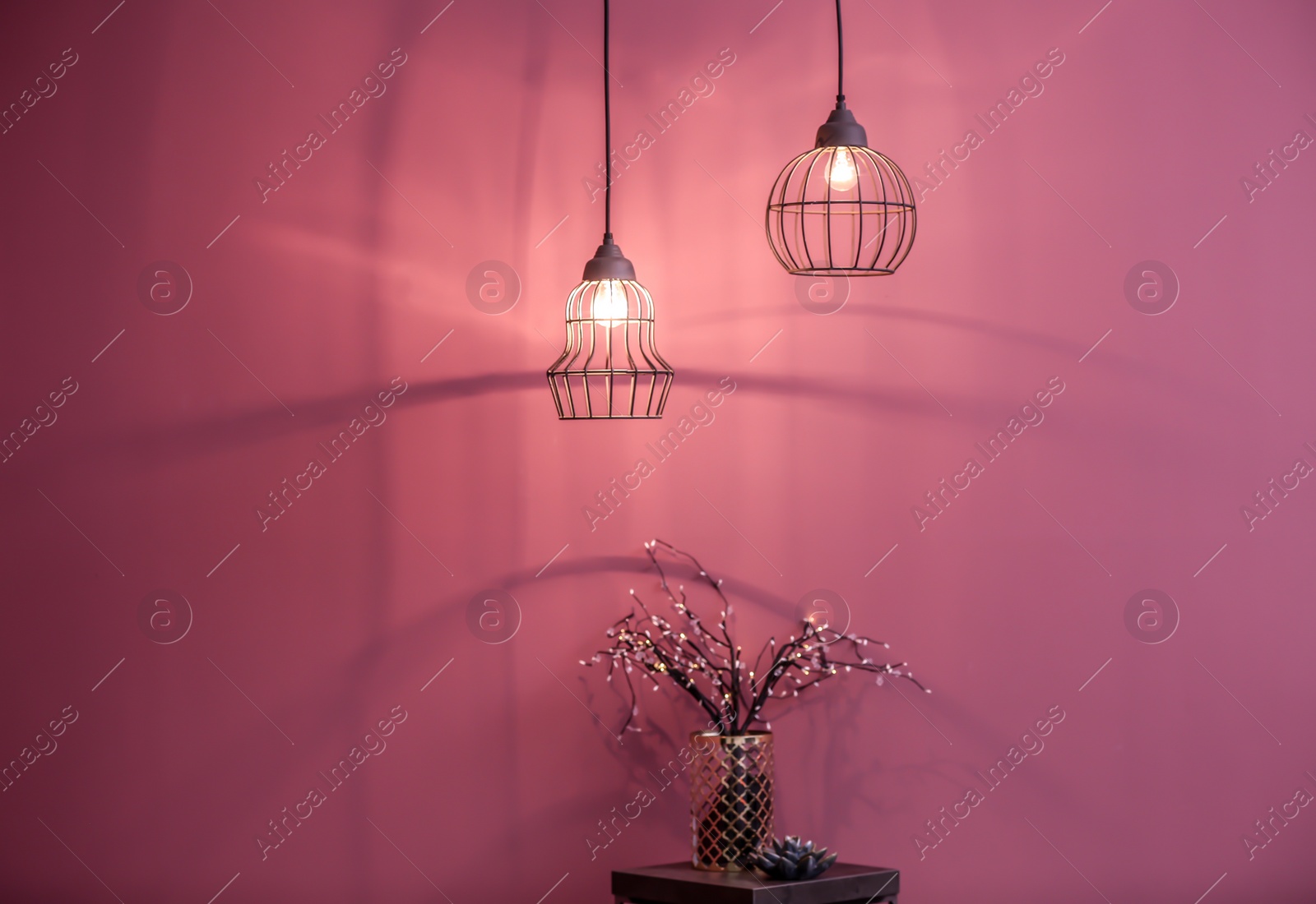 Photo of Room interior with elegant lamps and small table