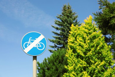 Road sign End Of Cycleway against blue sky. Space for text
