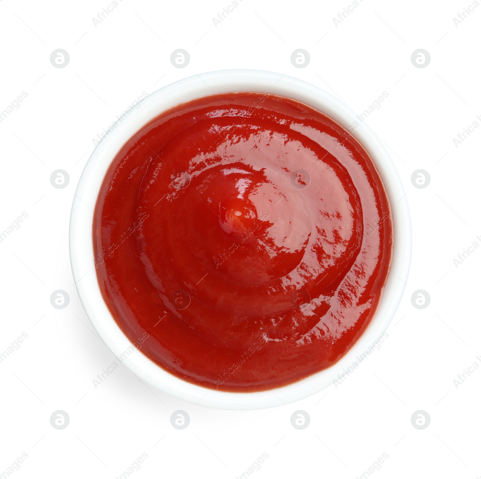 Photo of Tasty ketchup in bowl isolated on white, top view. Tomato sauce