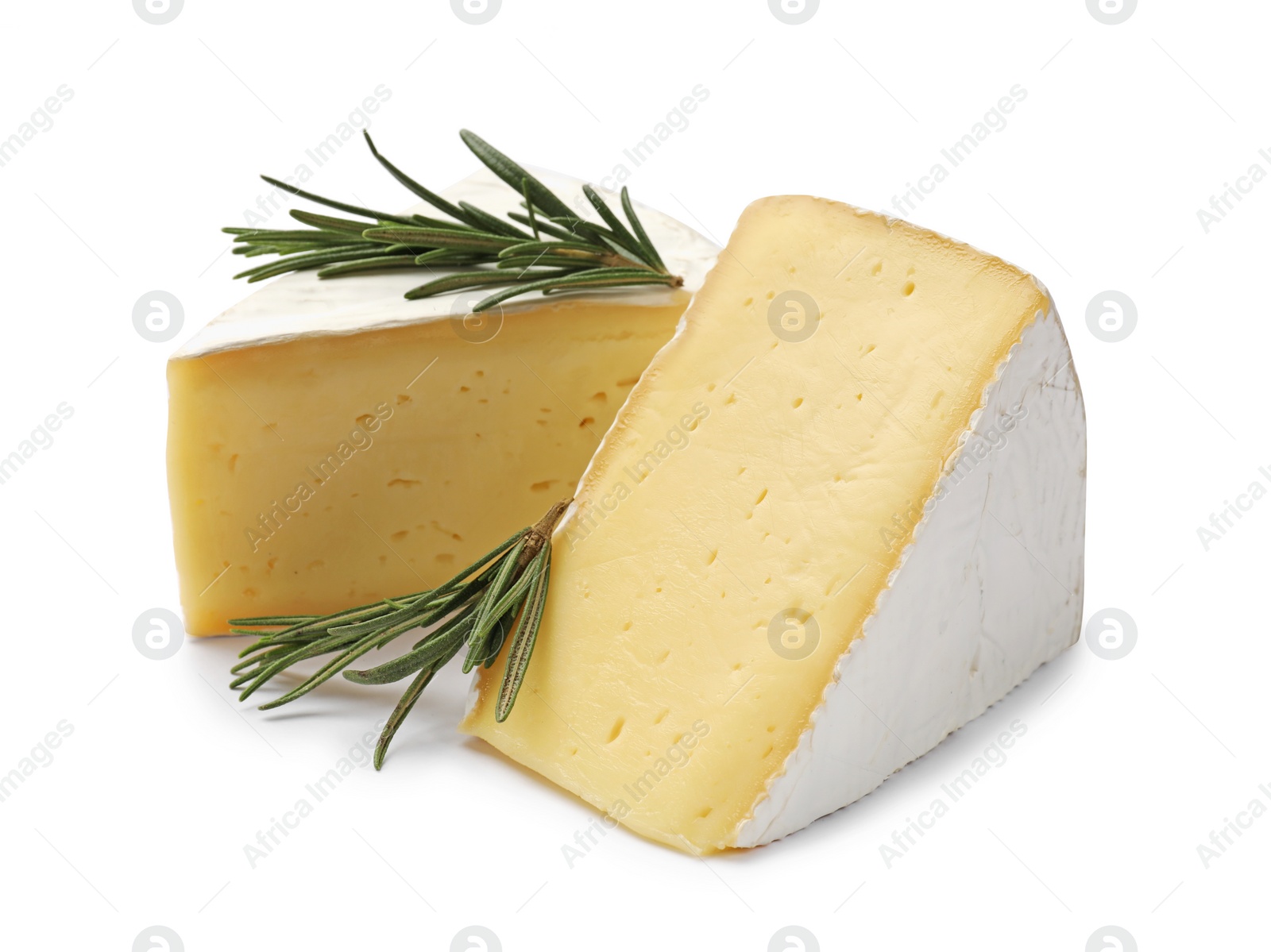 Photo of Pieces of tasty camembert cheese and rosemary isolated on white