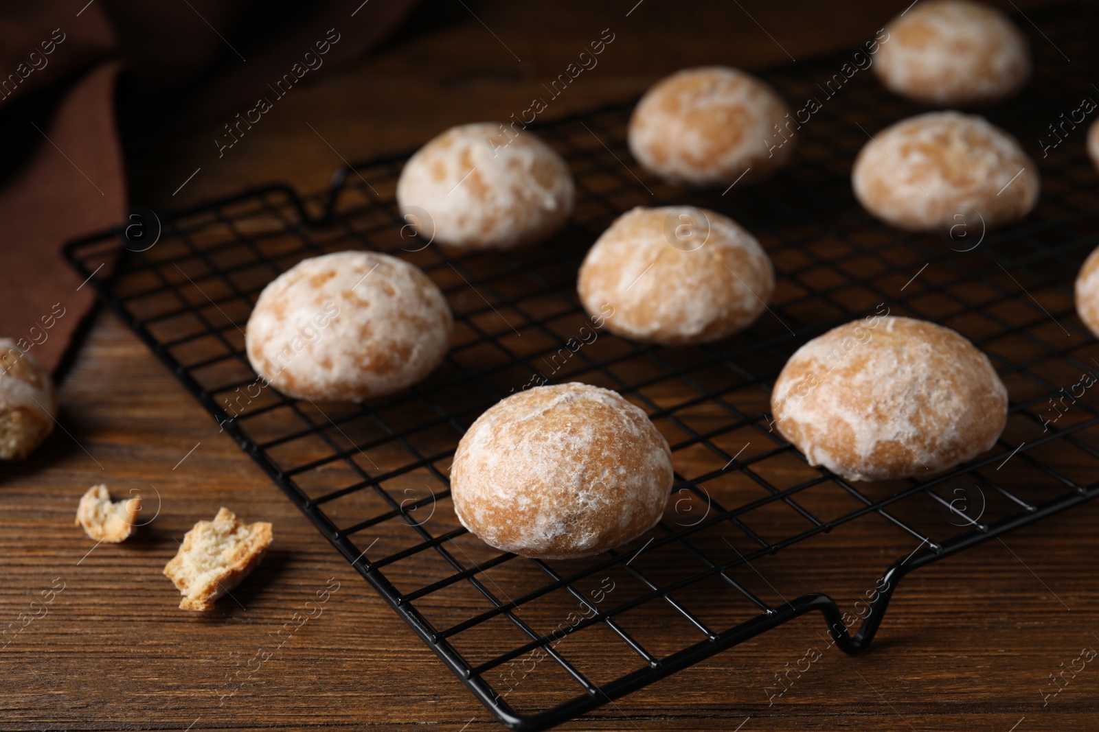 Photo of Tasty homemade gingerbread cookies on wooden table