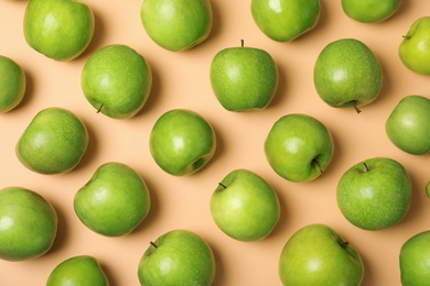 Photo of Many juicy green apples on color background, top view