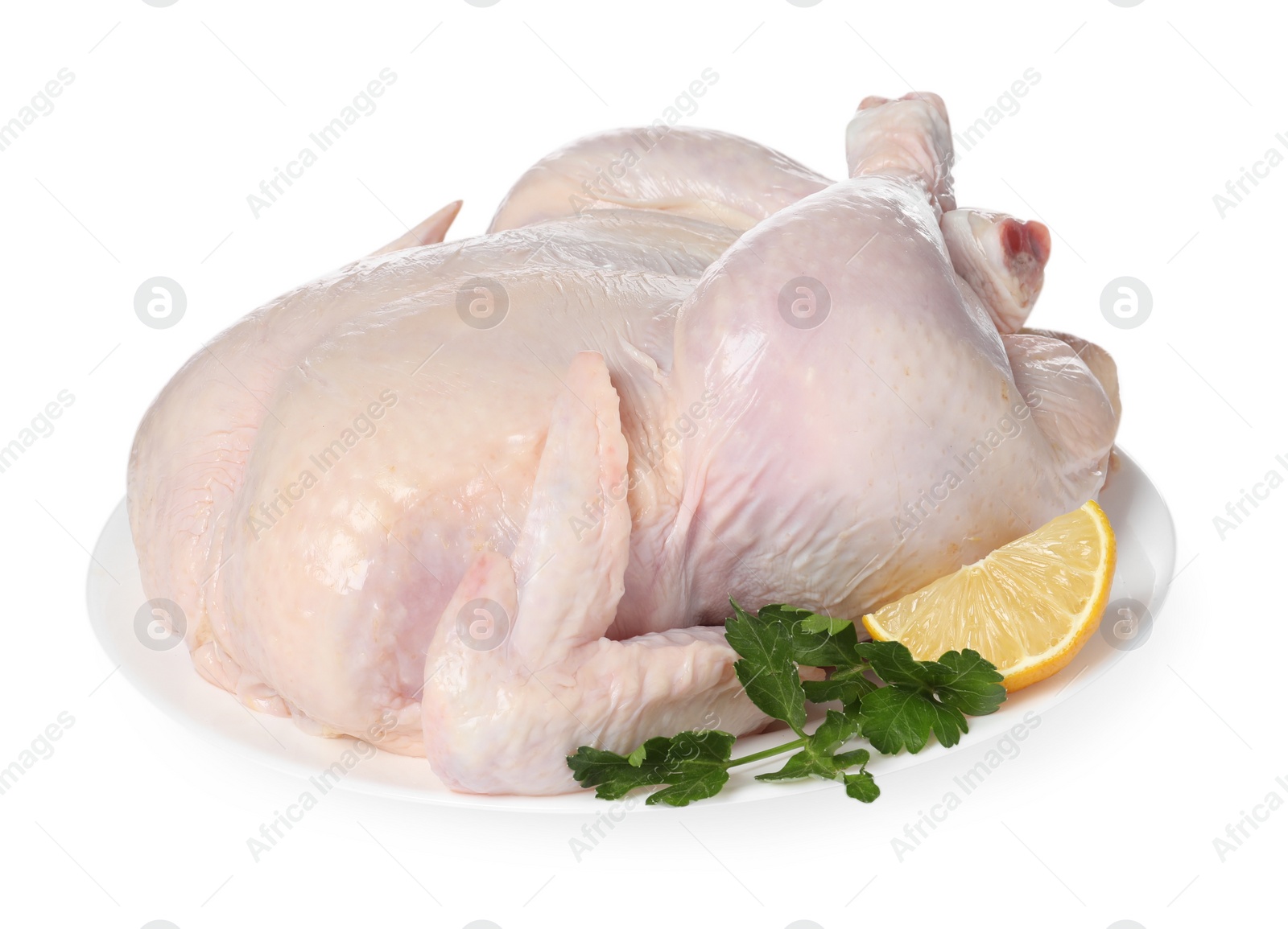 Photo of Fresh raw chicken with lemon and parsley isolated on white