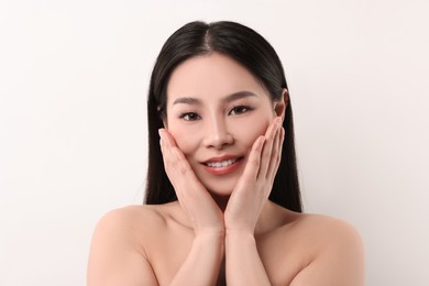 Portrait of beautiful woman on white background