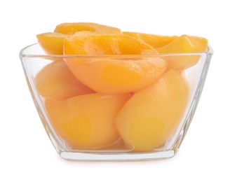 Halves of canned peaches in bowl isolated on white