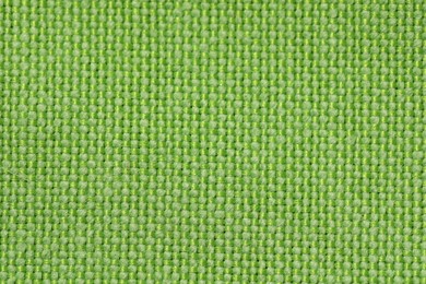 Texture of green fabric as background, top view