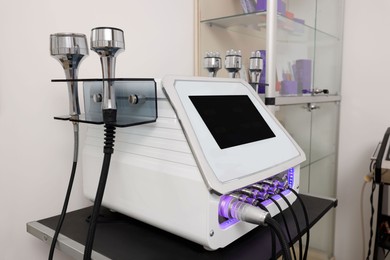Photo of Skin care machine with nozzles in beauty salon. Cosmetic procedure
