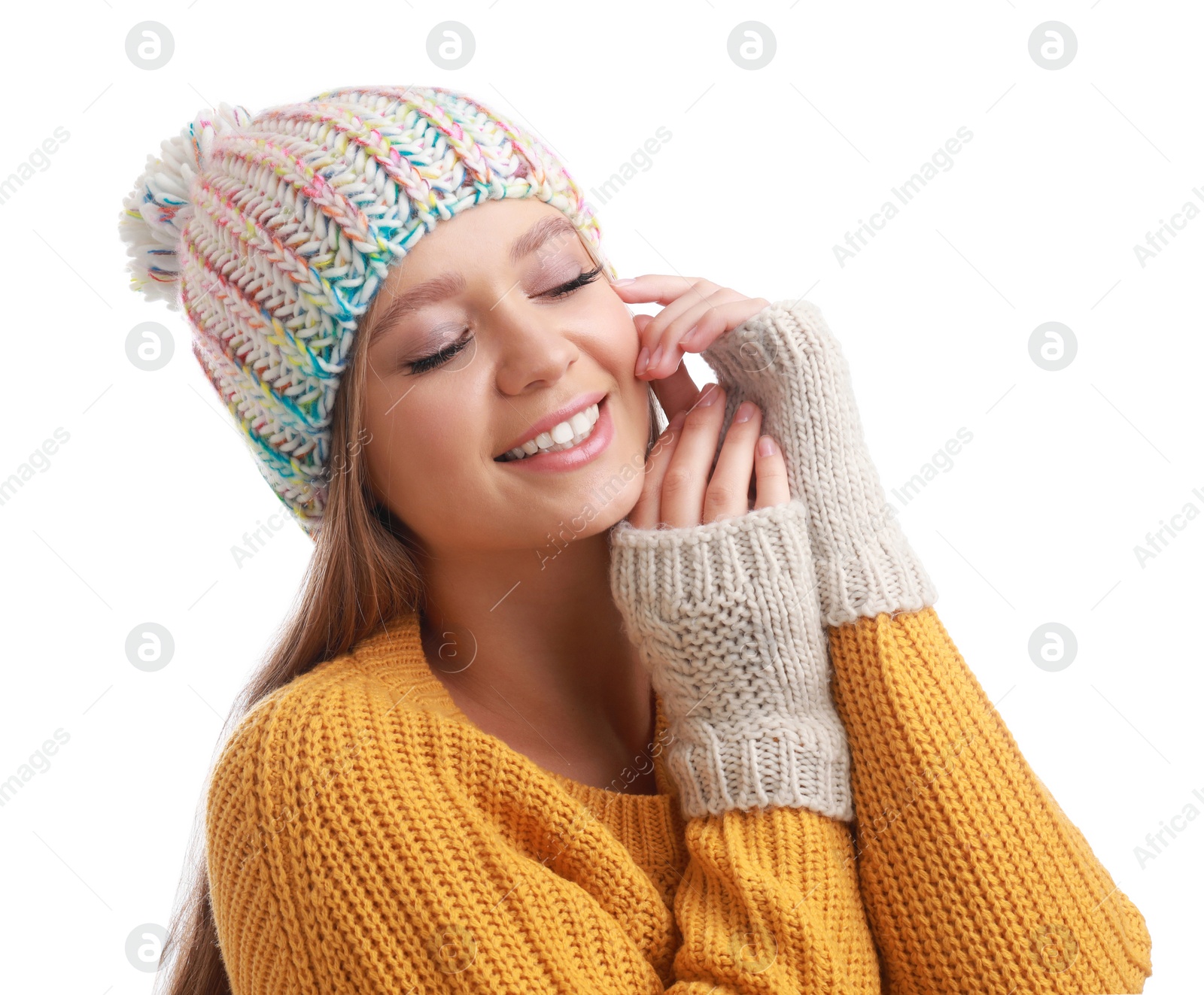 Photo of Young woman in warm sweater, mittens and hat on white background. Winter season