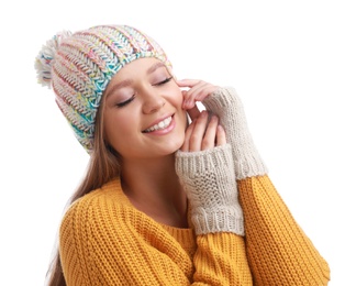 Photo of Young woman in warm sweater, mittens and hat on white background. Winter season