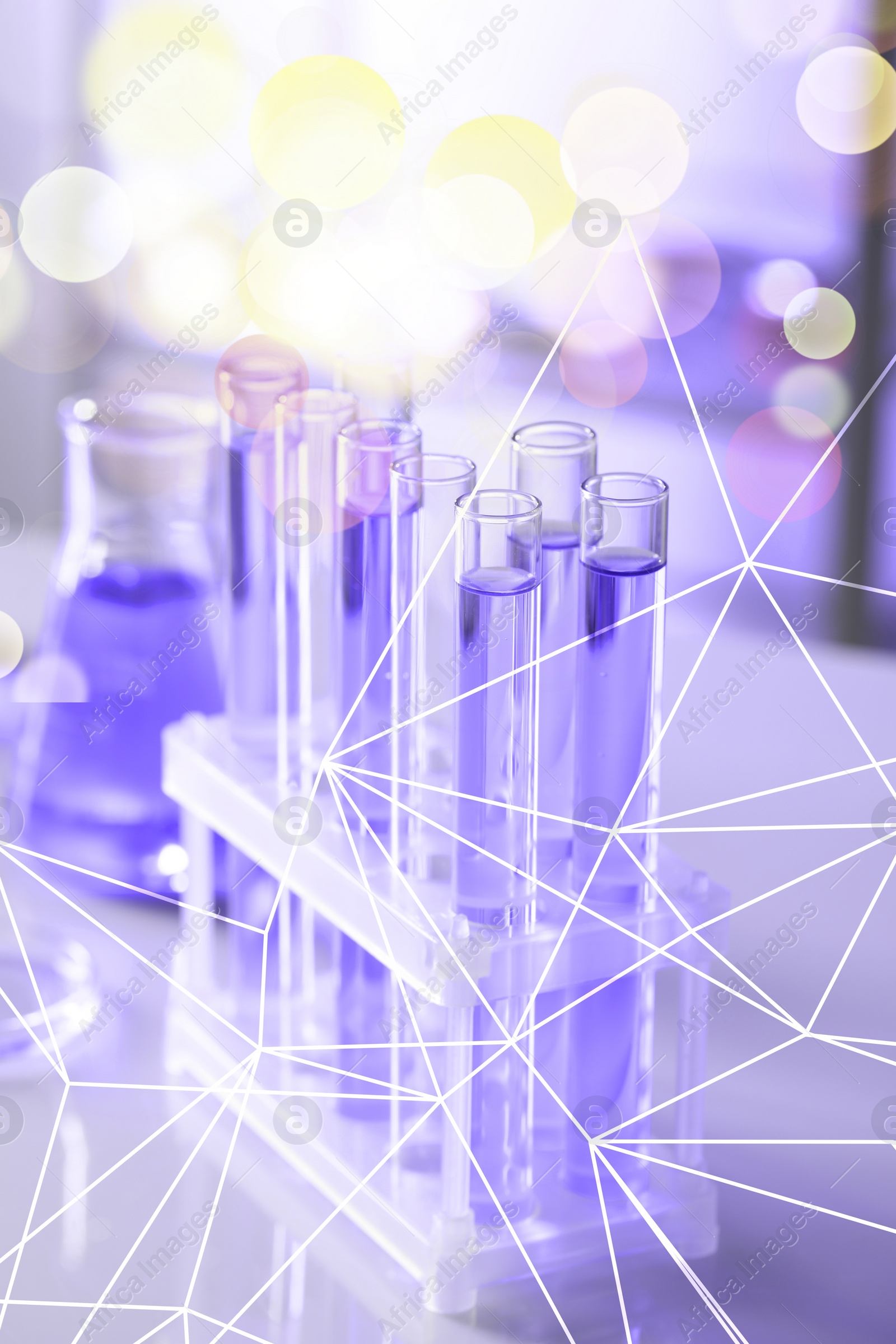 Image of Many test tubes in rack on table, closeup. Laboratory glassware