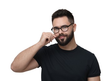 Photo of Happy young man touching mustache on white background