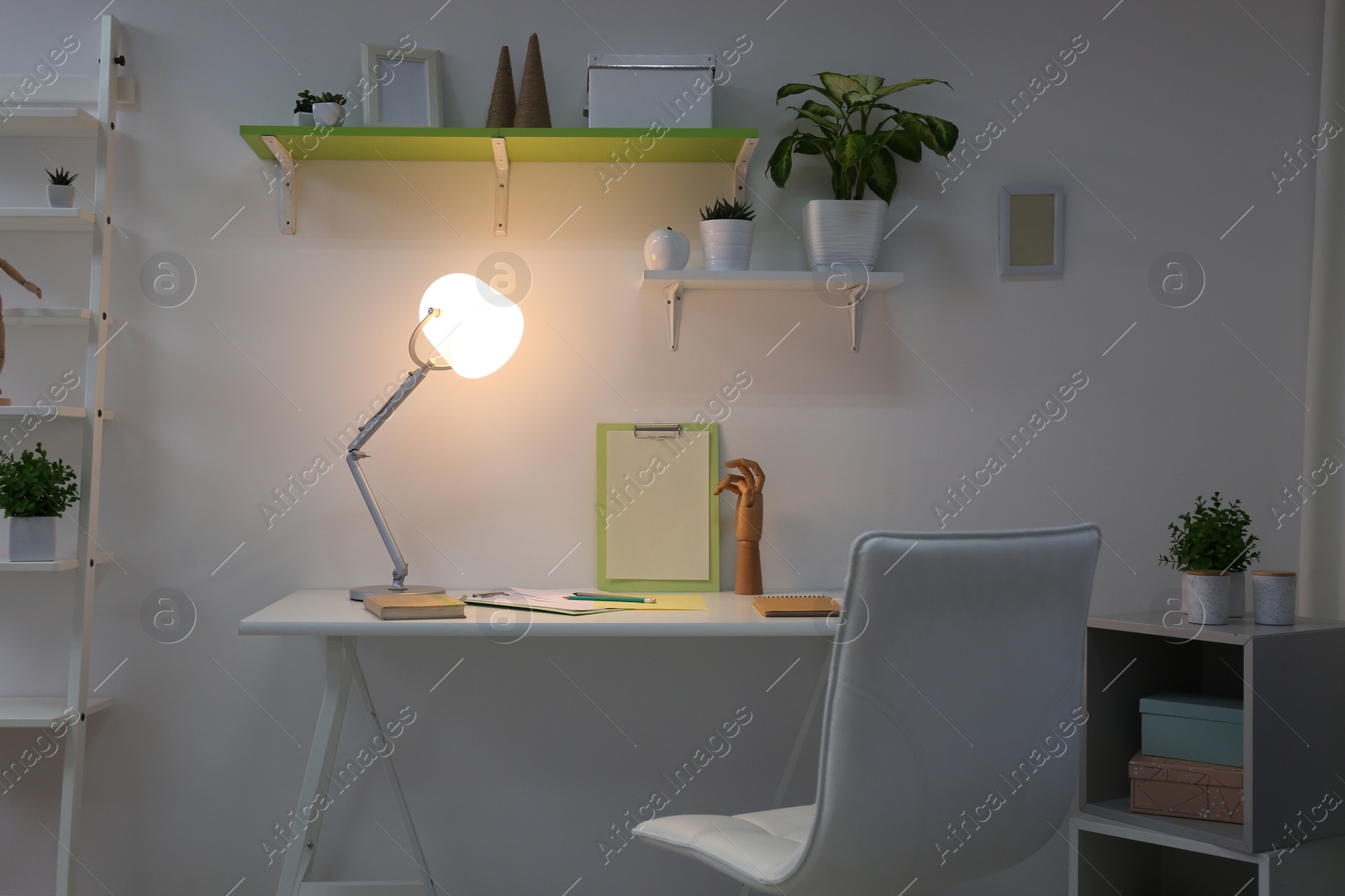 Photo of Stylish room interior with comfortable workplace. Design idea