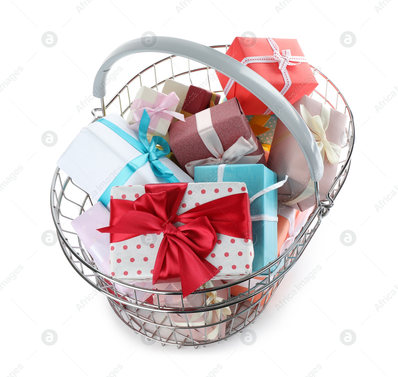 Photo of Shopping basket full of gift boxes on white background