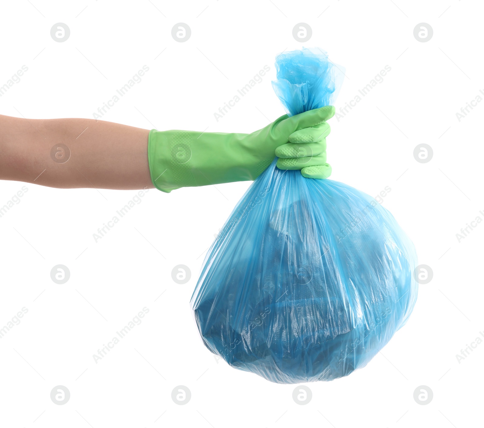 Photo of Woman holding plastic bag full of garbage on white background, closeup