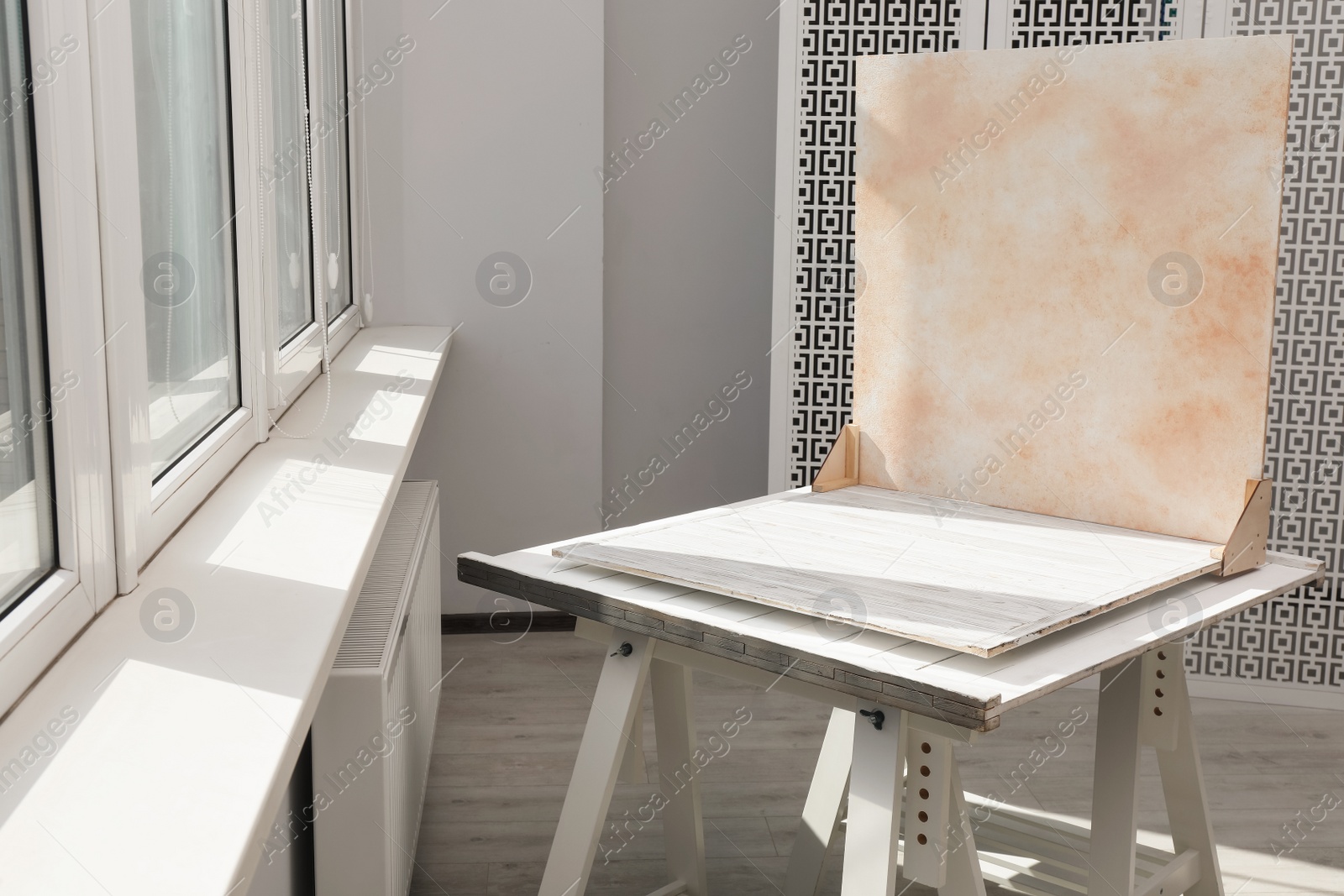 Photo of Double-sided backdrop on table in photo studio