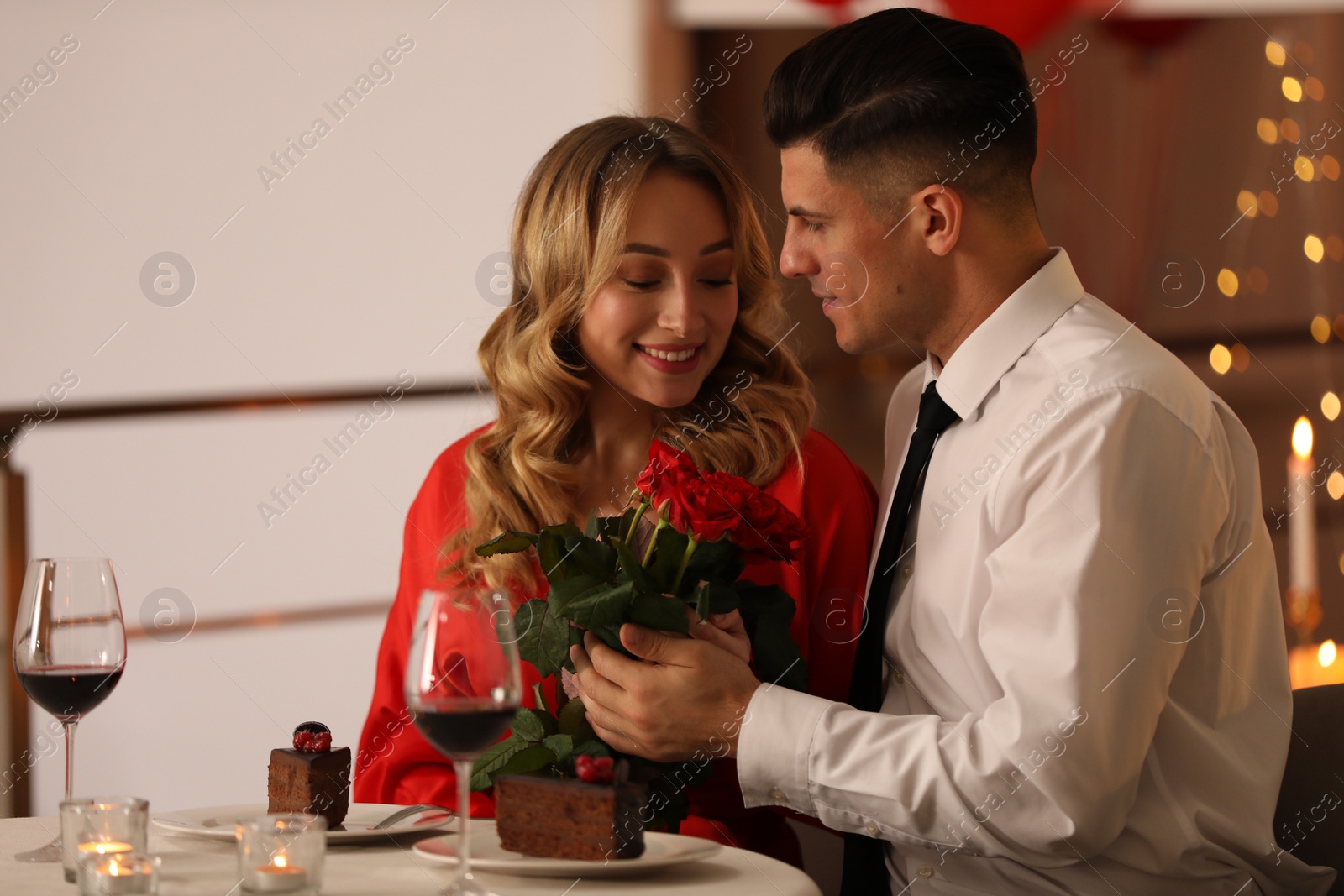 Photo of Lovely couple having romantic dinner on Valentine's day in restaurant