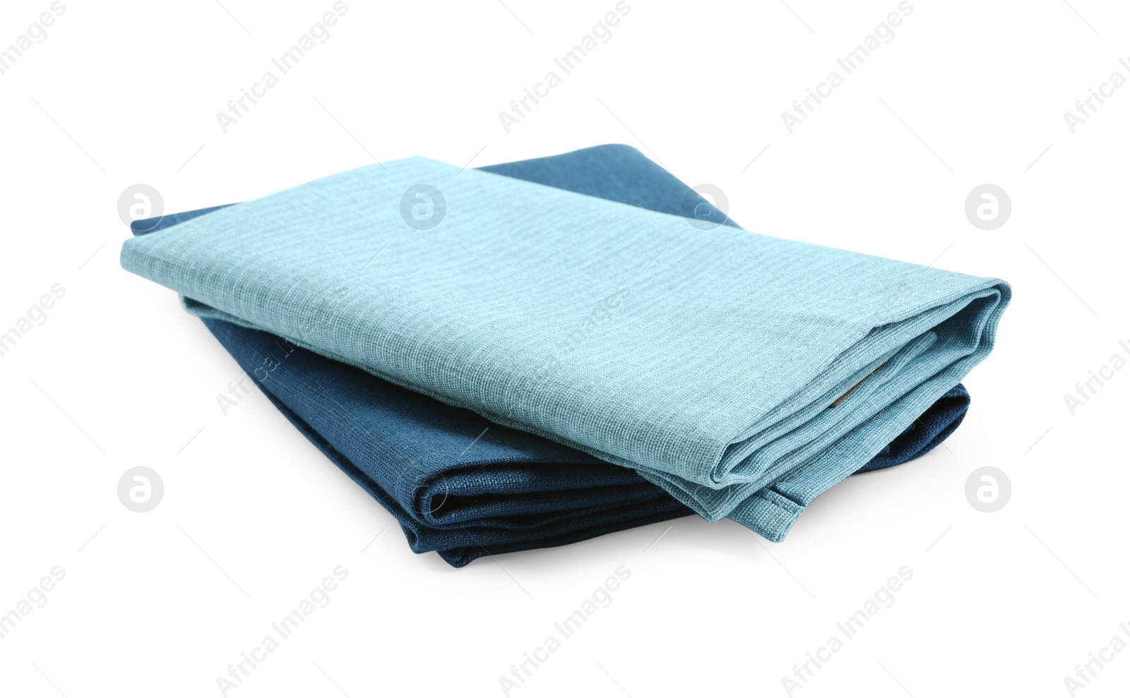 Photo of Folded fabric napkins for table setting isolated on white