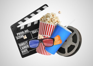 Image of Movie clapper, drink, pop corn, 3D glasses and film reel on white background. Collage design