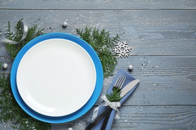 Photo of Beautiful Christmas table setting on grey wooden background, flat lay. Space for text