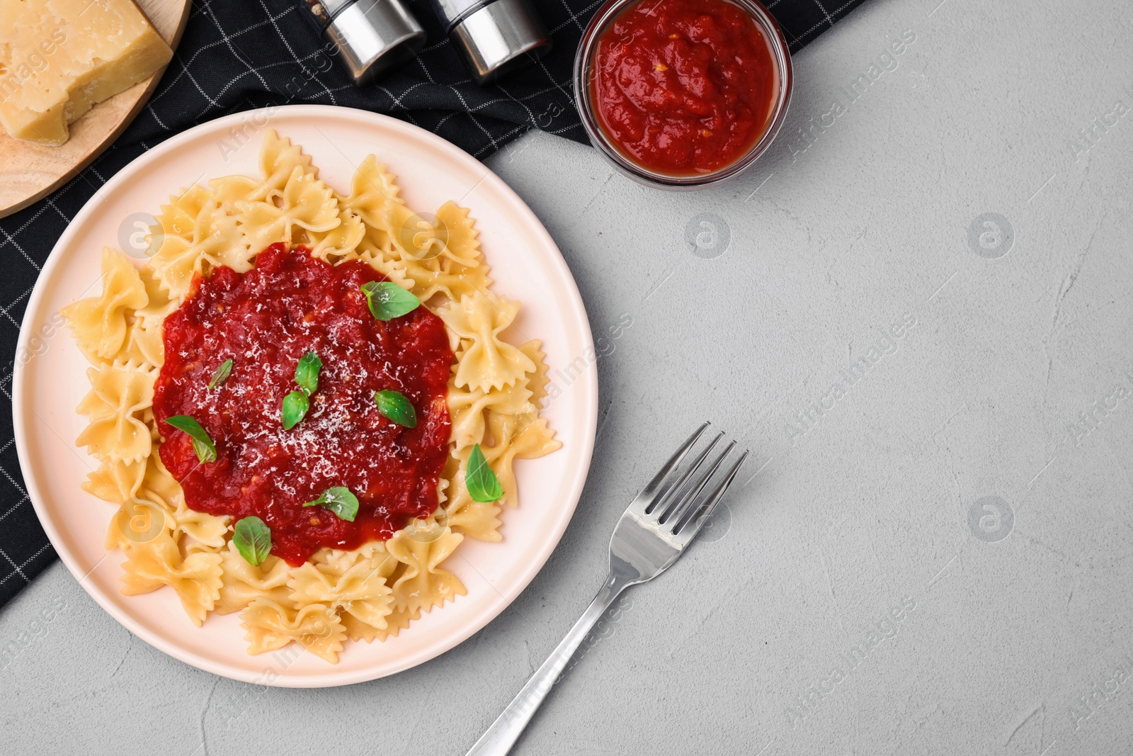 Photo of Flat lay composition with tasty pasta on light grey table