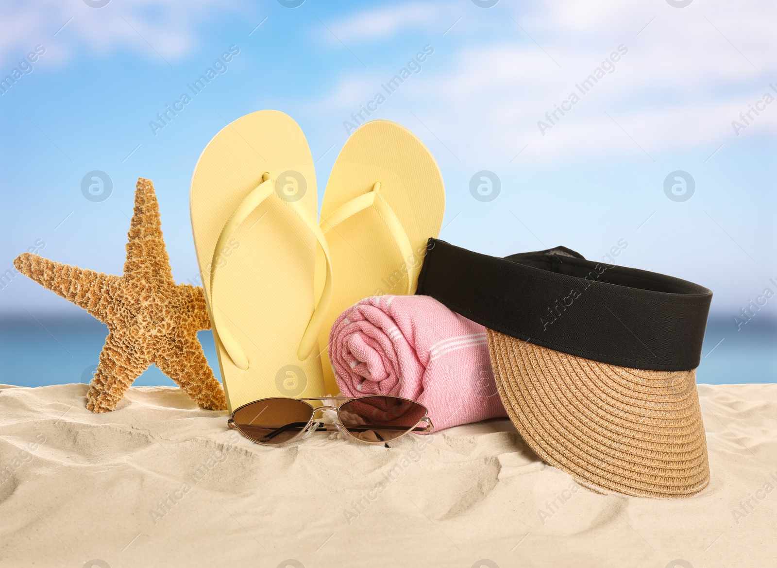 Image of Different beach objects on sandy beach near sea