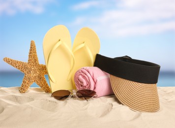 Image of Different beach objects on sandy beach near sea