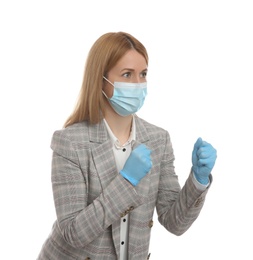 Photo of Businesswoman with protective mask and gloves in fighting pose on white background. Strong immunity concept