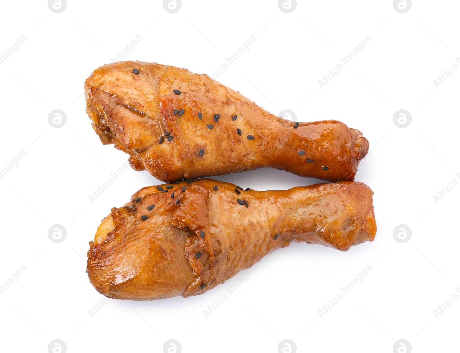 Photo of Chicken legs glazed with soy sauce isolated on white, top view