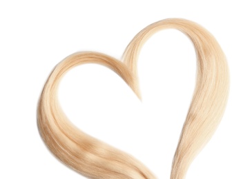 Photo of Heart made of blond hair locks on white background