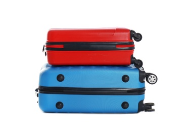 Photo of Modern suitcases for travelling on white background