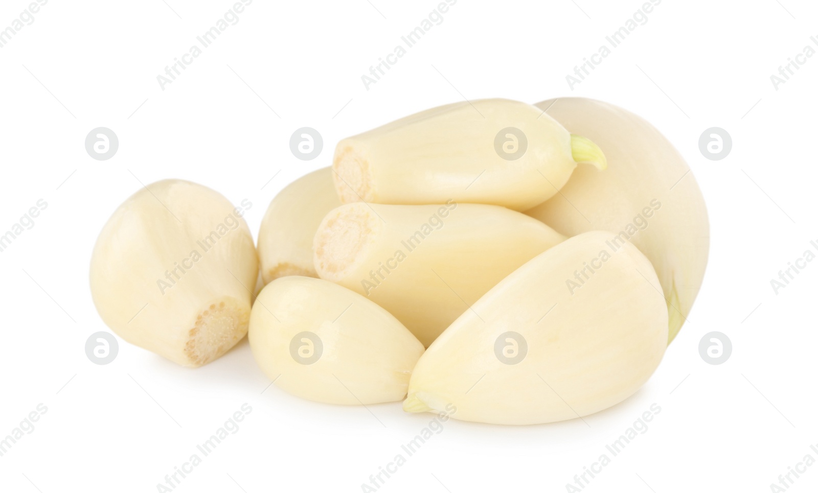 Photo of Peeled cloves of fresh garlic isolated on white