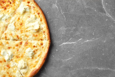 Delicious cheese pizza on grey background, top view