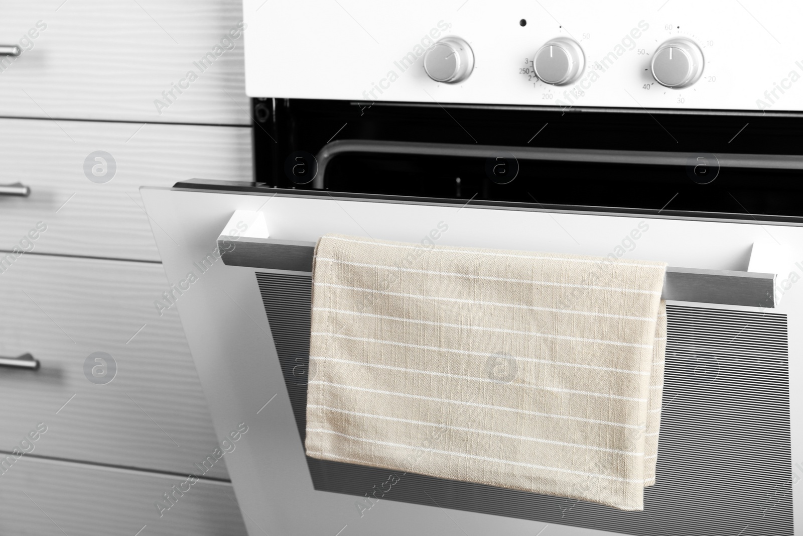 Photo of Open modern electric oven in kitchen, closeup view