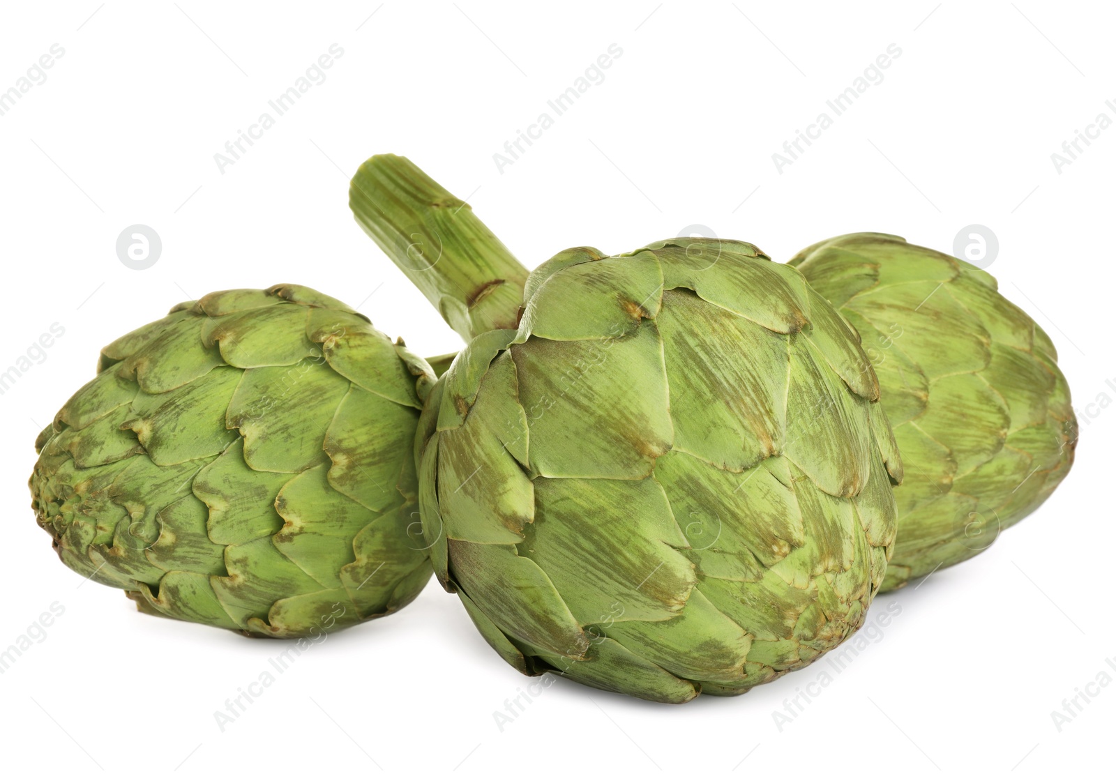 Photo of Whole fresh raw artichokes on white background