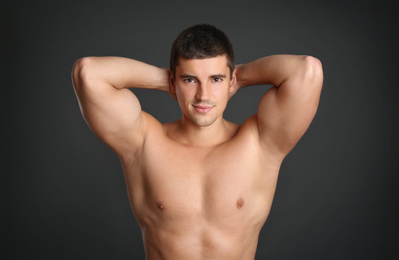 Photo of Man with sexy body on grey background