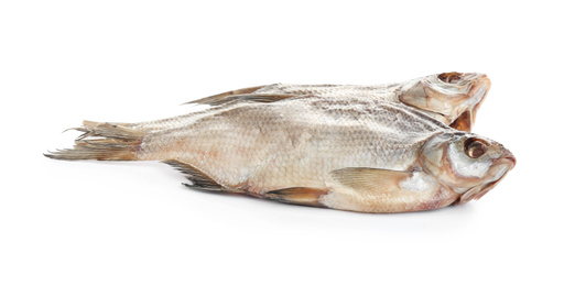 Photo of Tasty dried fish isolated on white. Seafood