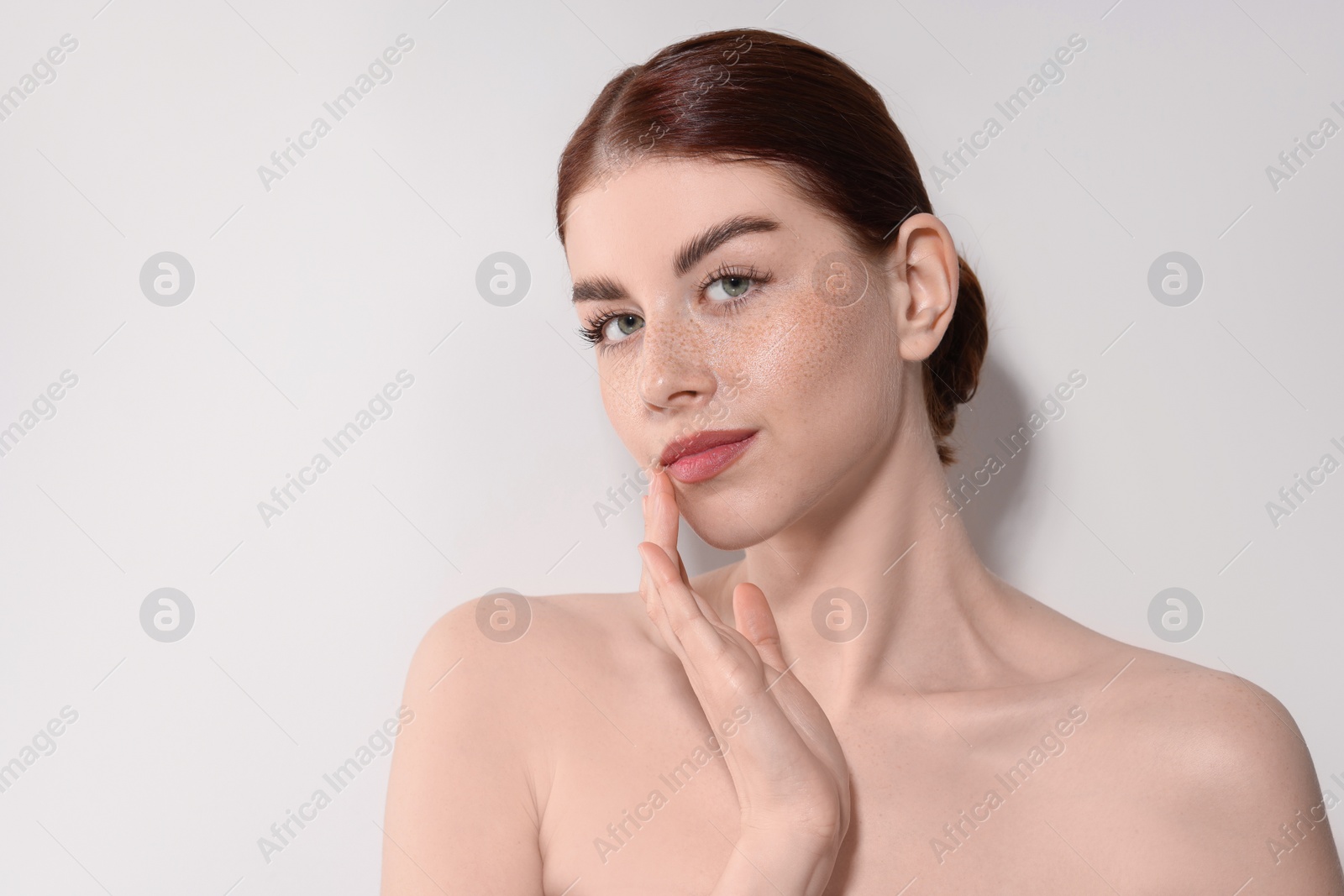 Photo of Portrait of beautiful woman on light background. Space for text